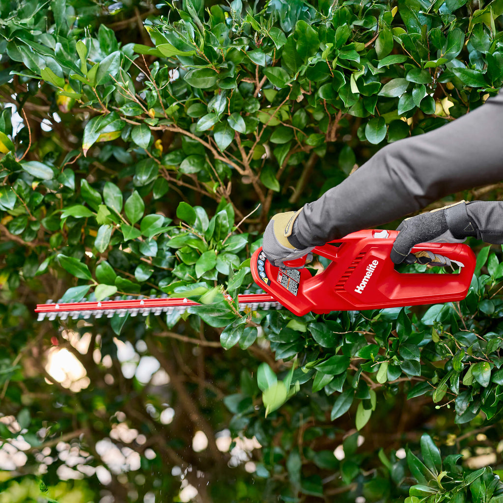 12V 18” Hedge Trimmer trimming side of shrub