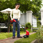 13" Electric String Trimmer/Edger side profile trimming the grass around a walkway